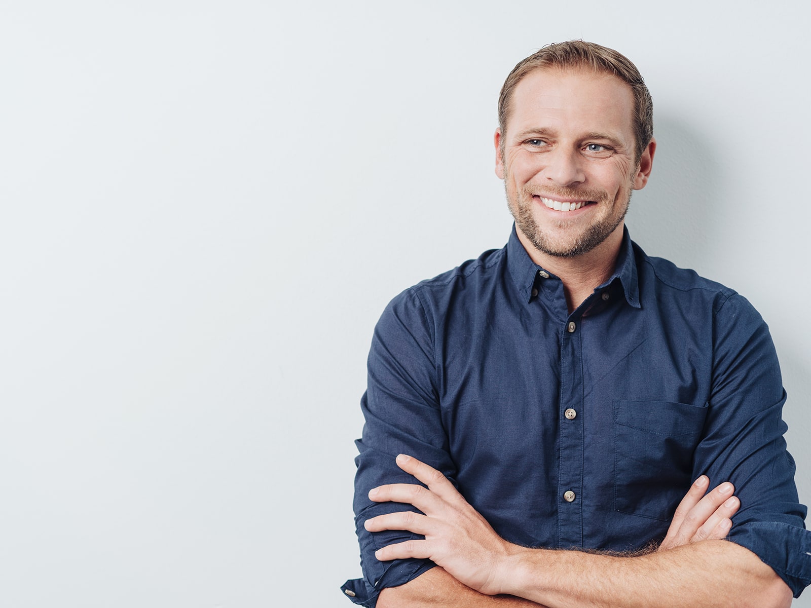 Man in blue shirt on white background